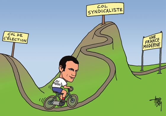 كاريكاتير ساخر لماكرون وهو يقود دراجته