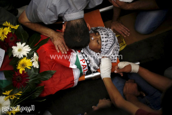 	جثة الطفل الفلسطينى البالغ من العمر 13 عاما 