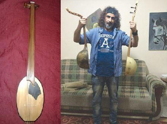	فنان عراقى يصنع آلات موسيقية من بقايا الحرب -اليوم السابع -10 -2015