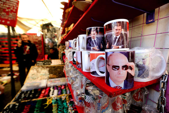 صورة بوتن وبشار فى سوق الحميدية -اليوم السابع -11 -2015