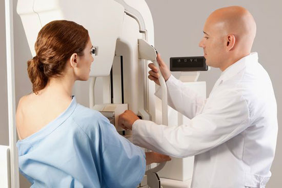 Doctor-assisting-a-female-patient-for-mammogram
