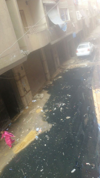 قارئ يشكو غرق شارع حسين غلاب فى مياه الصرف الصحى بفيصل (5)