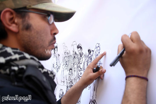 	محمد وهو يرسم. -اليوم السابع -4 -2015