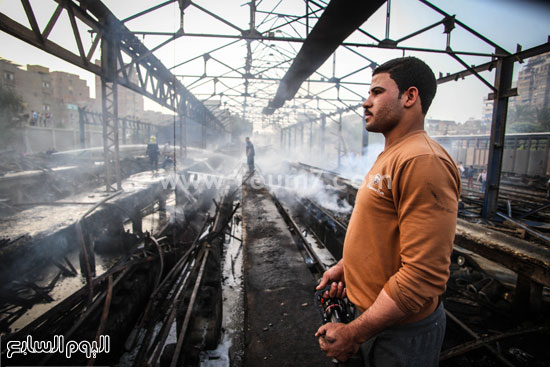 	المطافئ تحاول تبريد مكان الحريق بعد إخماد النيران -اليوم السابع -4 -2015