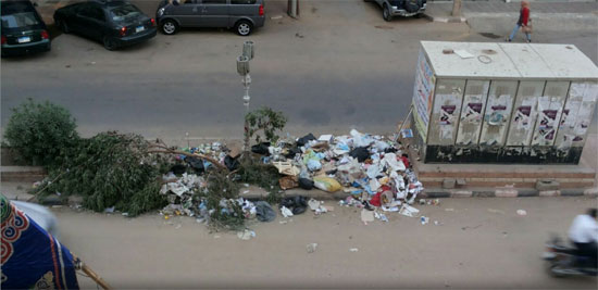  انتشار القمامة فى شارع الجمهورية بسوهاج -اليوم السابع -5 -2015