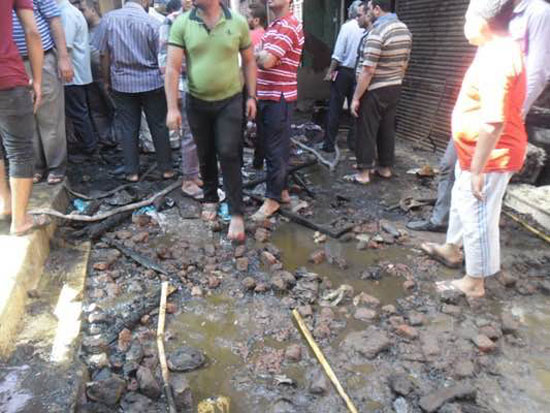 	آثار المياه بالشوارع بعد الإطفاء -اليوم السابع -5 -2015