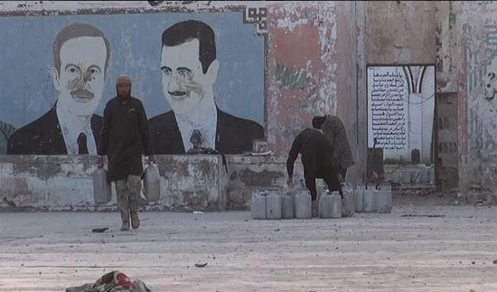 4-	صور بشار الأسد ووالده على حائط السجن  -اليوم السابع -5 -2015
