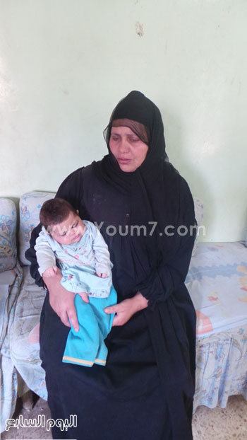  صورة لزوجة المجنى عليه وابنته هاجر 50 يوما -اليوم السابع -5 -2015