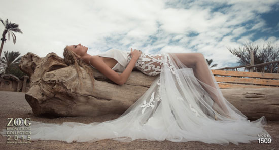 صورة لموديل نائمة على جذع شجرة بفستان زفاف غاية فى الرقة ينتهى بشفافية قماشه -اليوم السابع -5 -2015