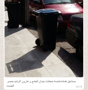 أصحاب محلات مصر الجديدة يغلقون صناديق القمامة بالجنازير (2)