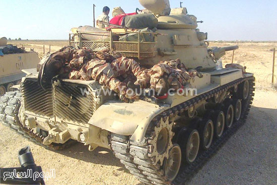 صور قتلى العناصر الإرهابية أعلى دبابة للجيش المصرى  -اليوم السابع -7 -2015
