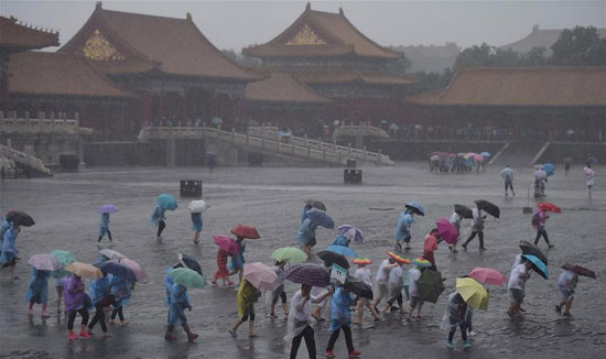 أمطار غزيرة تضرب العاصمة الصينية بكين (5)