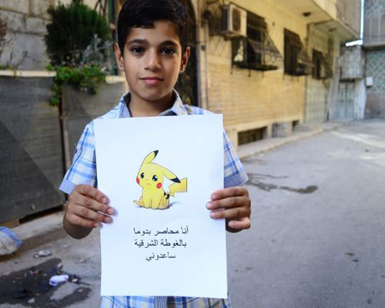 طفل-سوري-يرفع-شعار-Pokemon-(3)