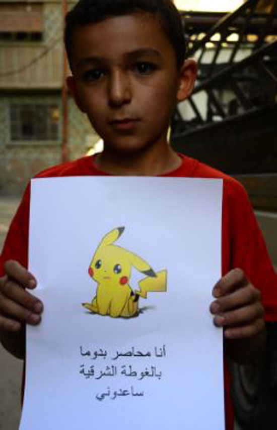 طفل-سوري-يرفع-شعار-Pokemon-(5)