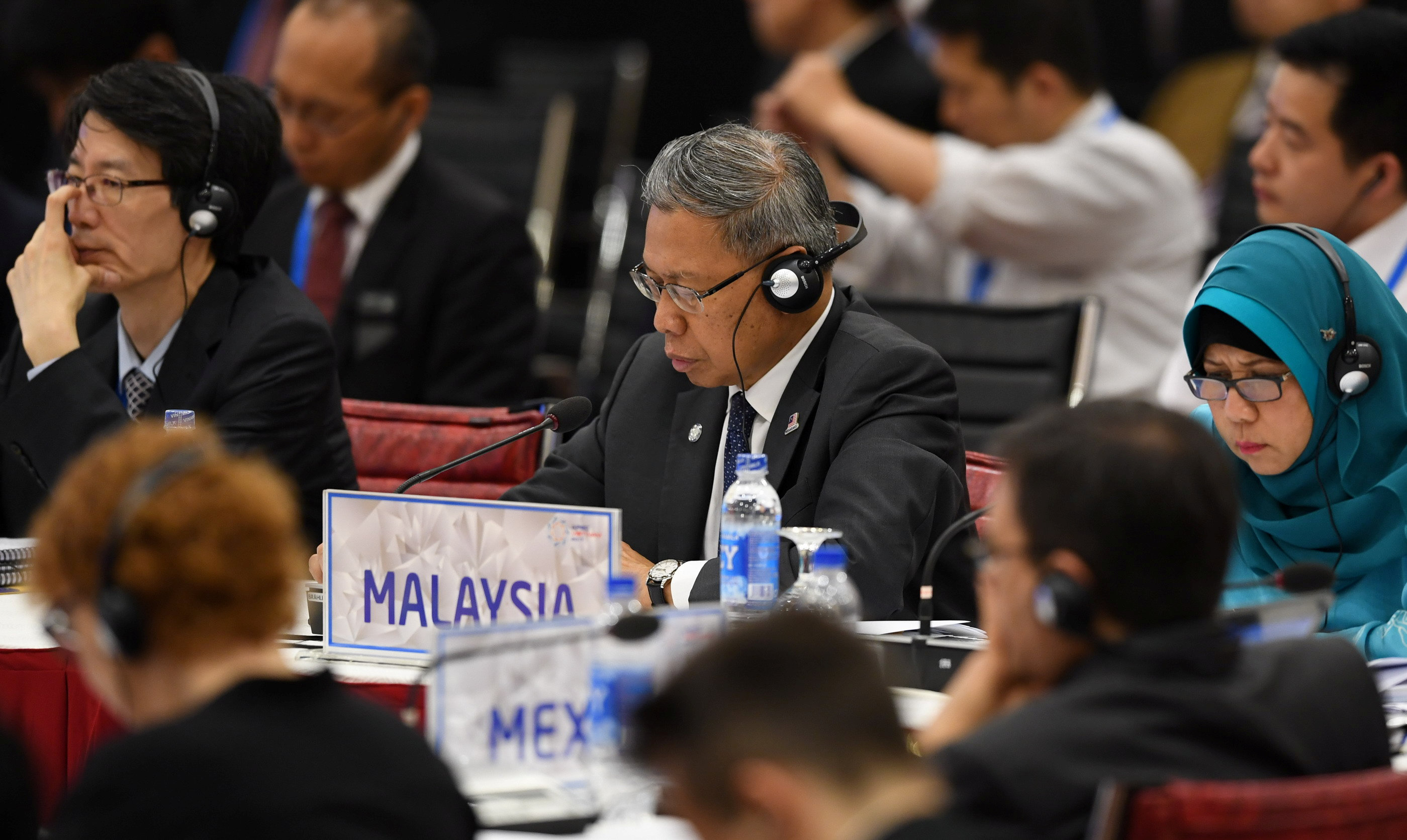 وزير التجارة الماليزى خلال اجتماع منظمة الايبك