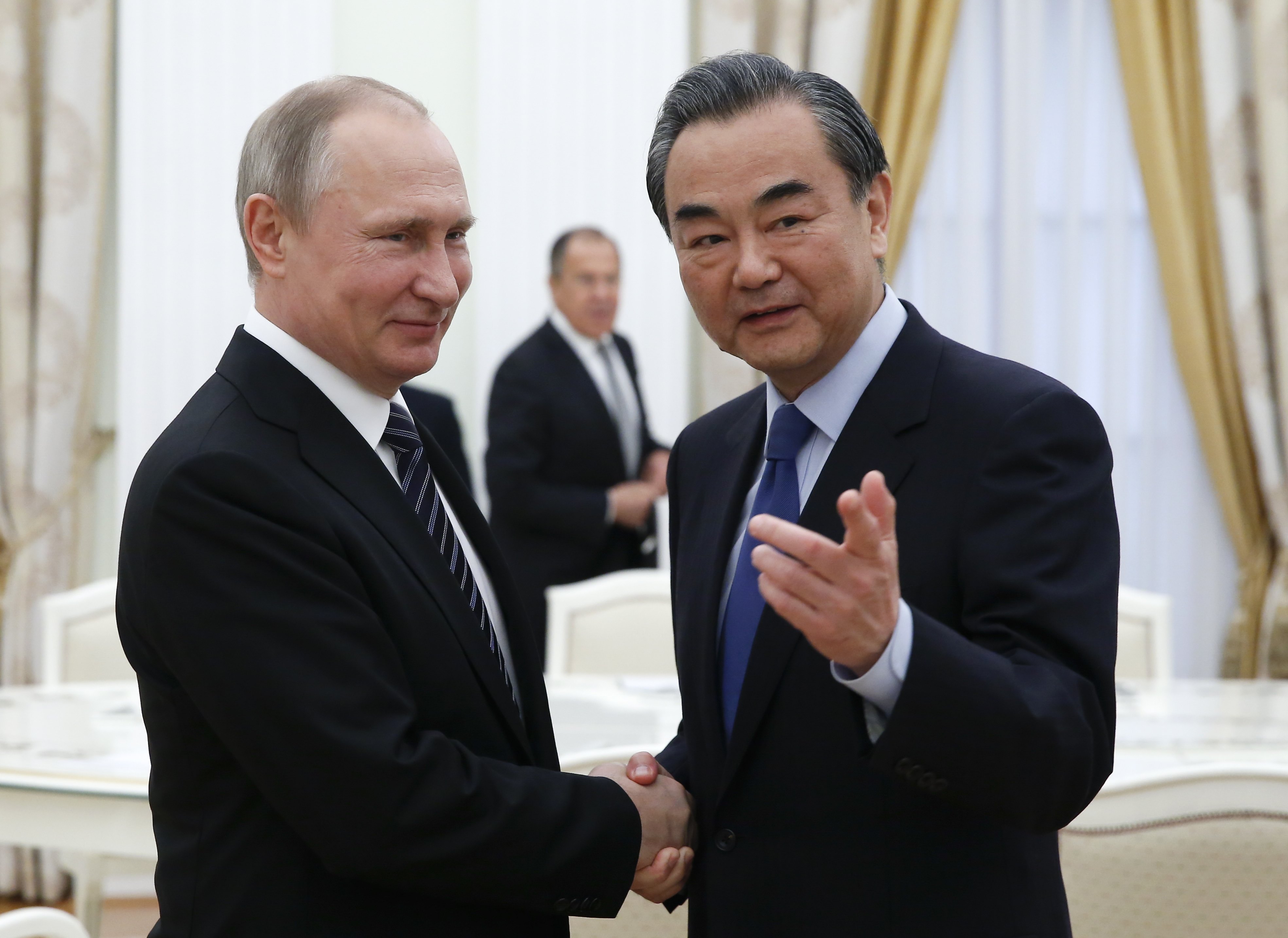 الرئيس الروسى بوتين ووزير الخارجية الصينى
