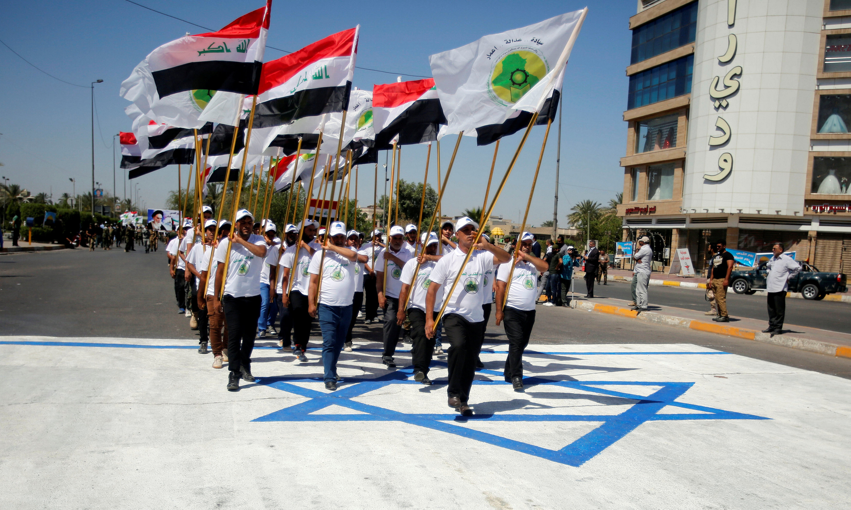 مسيرات  بالأعلام العراقية على العلم الإسرائيى