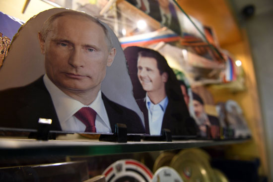 صور بوتين وبشار الأسد فى محل ذهب 