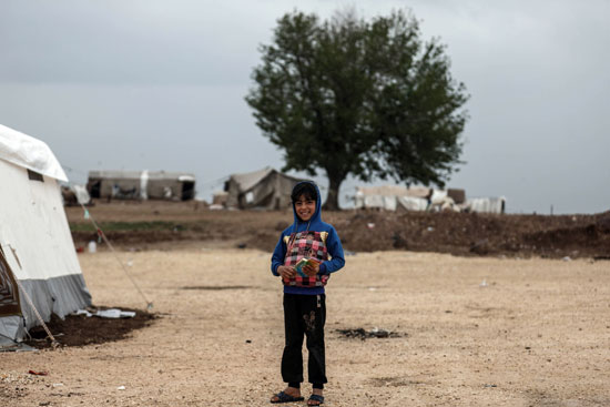 ابتسامة طفل سورى رغم ويلات الحرب 