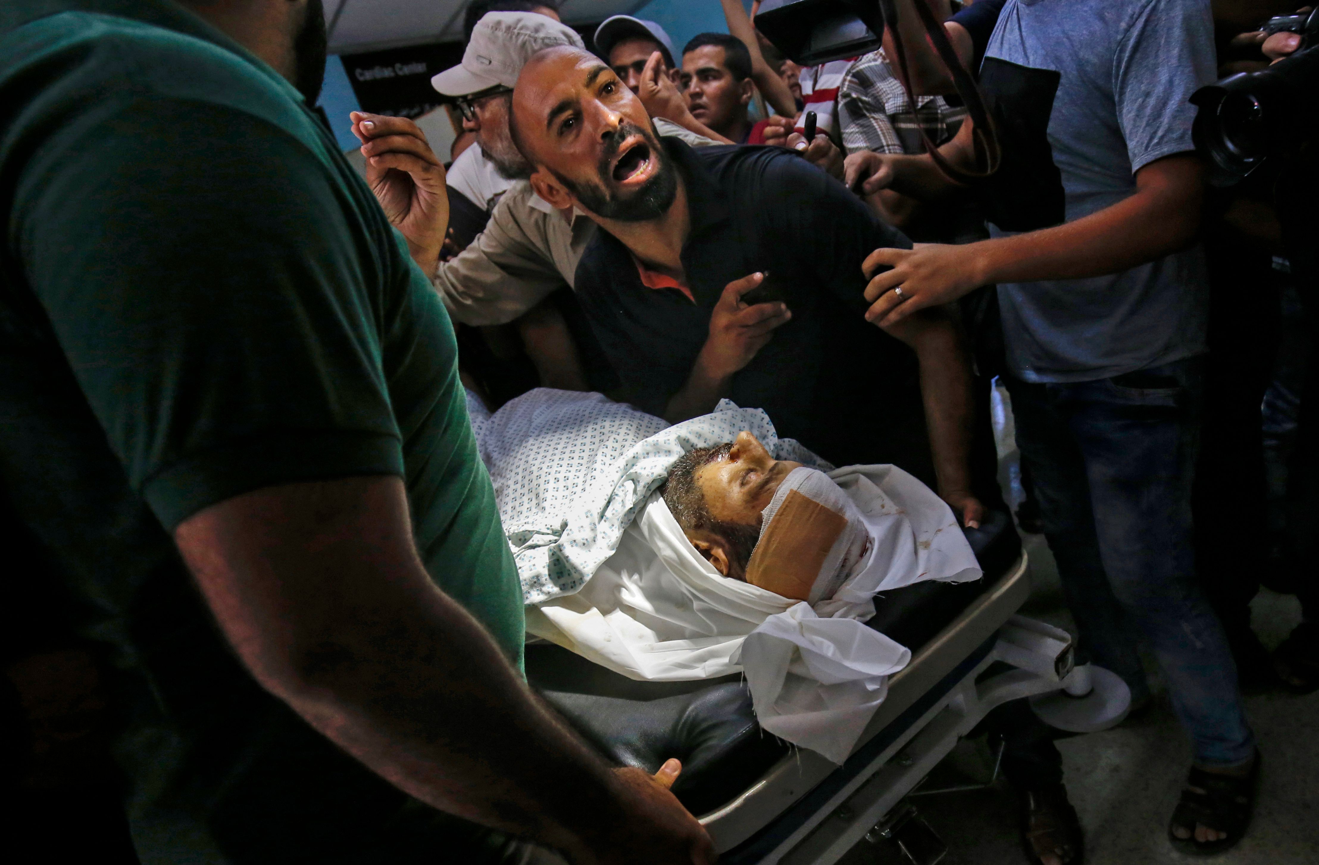 جثمان فلسطينى استشهد فى قصف للاحتلال