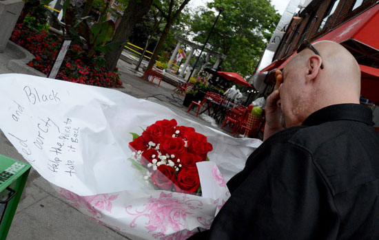   A citizen puts roses on the set 