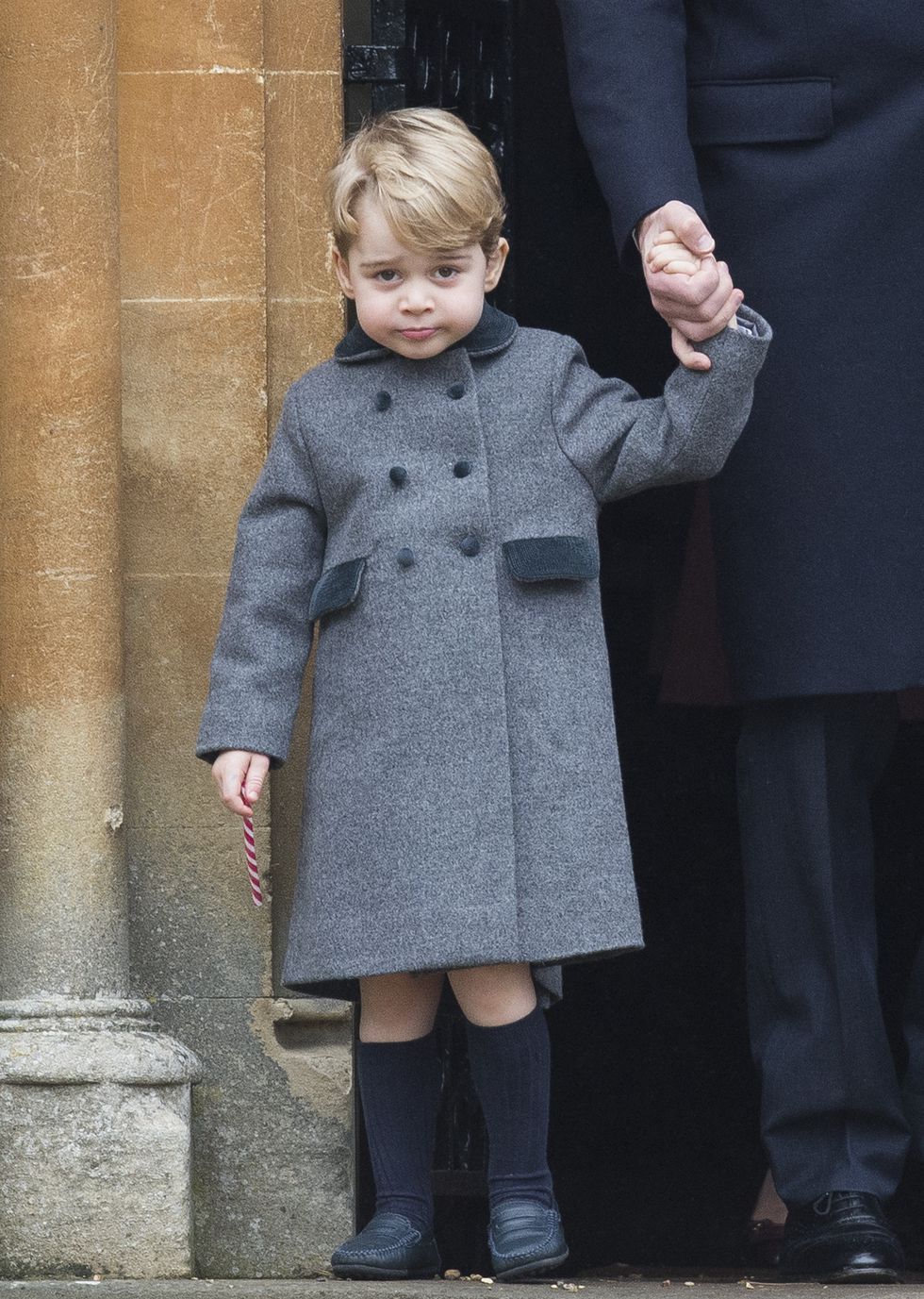 الأمير جورج فى معطف رمادى