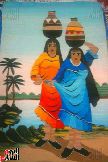 لوحة فنية تعبر عن الفلاحة المصرية وحملها للبلاص من نهر النيل بزيها المميز