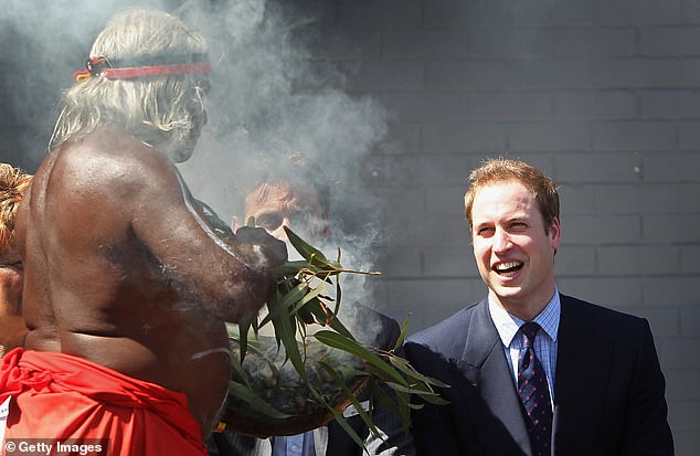 8913688-6621717-Prince_William_laughs_as_an_Aboriginal_elder_wafts_smoke_in_his_-a-11_1548393519604