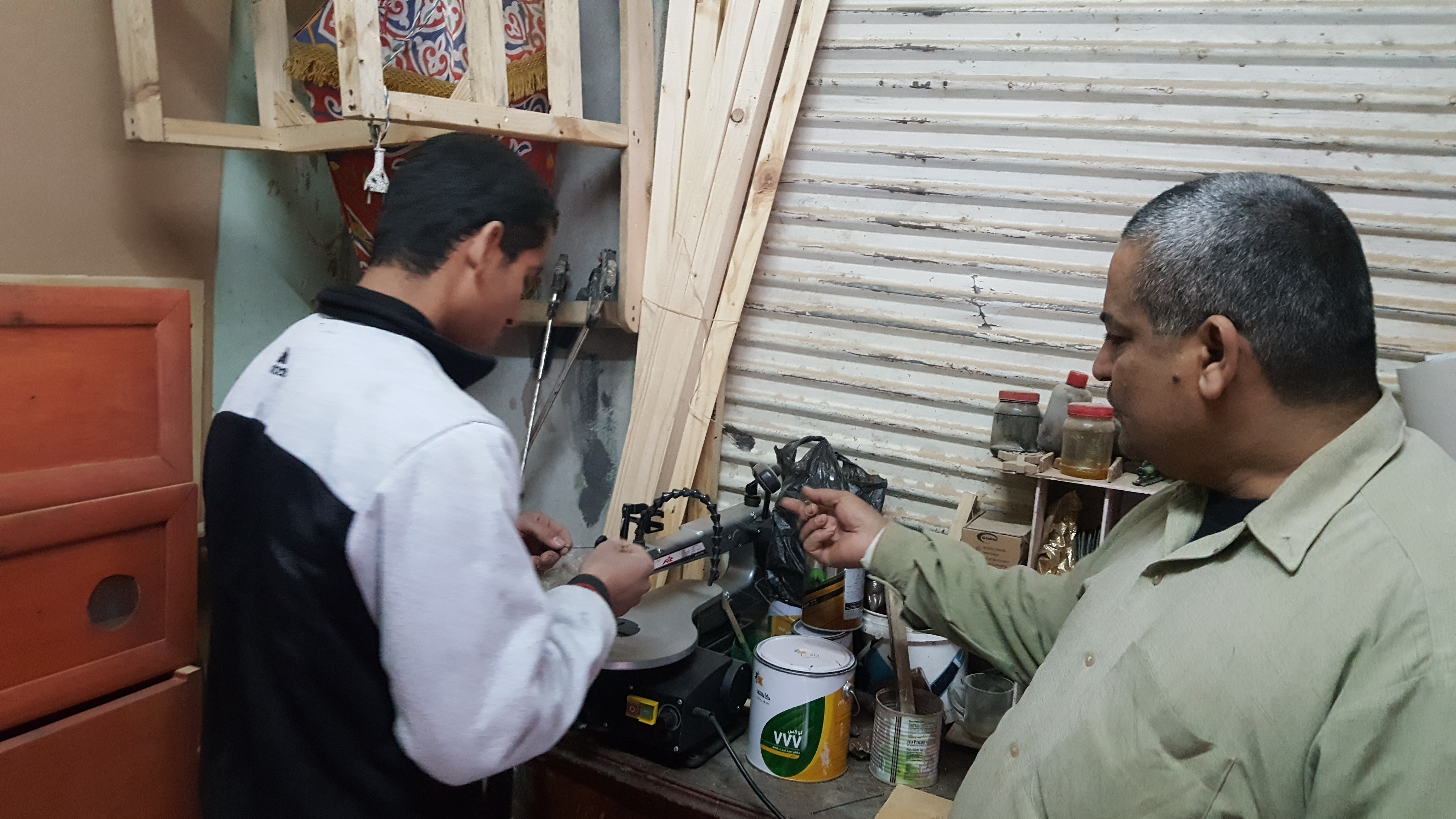 أحمد عوض يتحدى الإعاقة بالفن  (3)