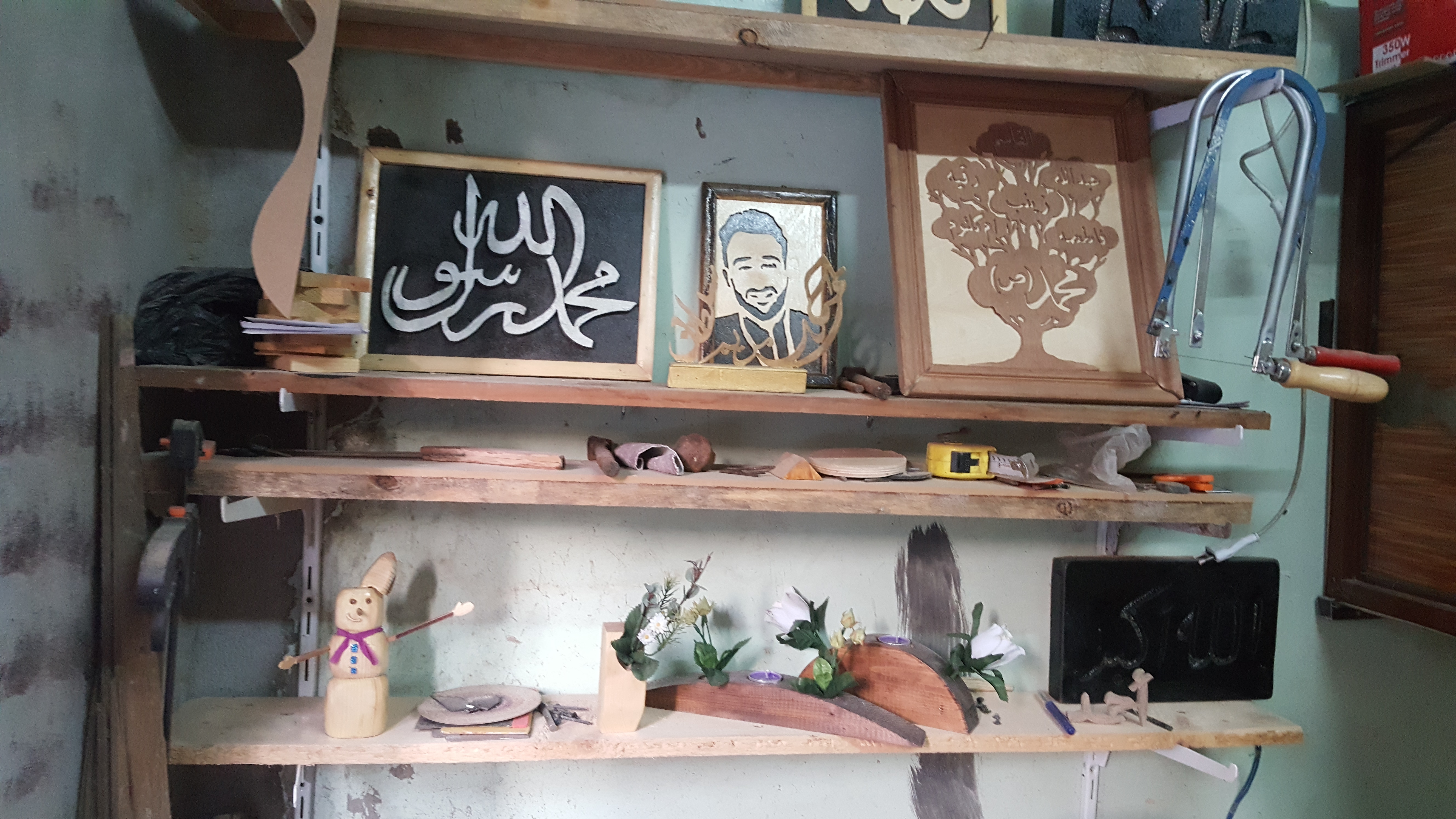 أحمد عوض يتحدى الإعاقة بالفن  (2)
