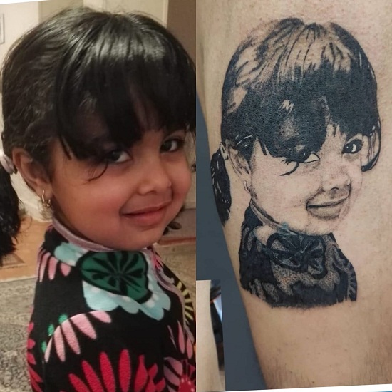 أب رسم أبنته على ذراعه أب رسم أبنته على ذراعه