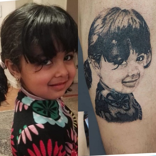أب رسم أبنته على ذراعه