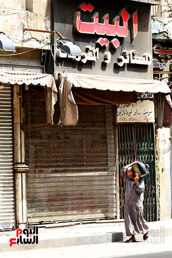 غلق المحلات فى شارع بورسعيد تطبيقا لقرار الحكومه (17)