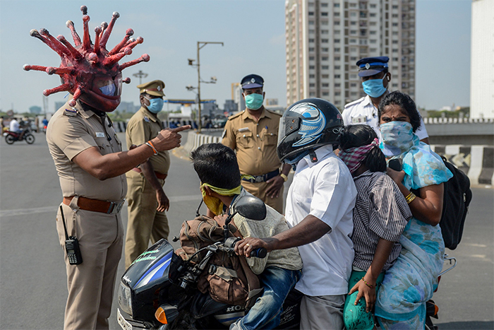 indian-policeman-wears-coronavirus-helmet-warn-people-stay-home-3-5e81b513d6021__700