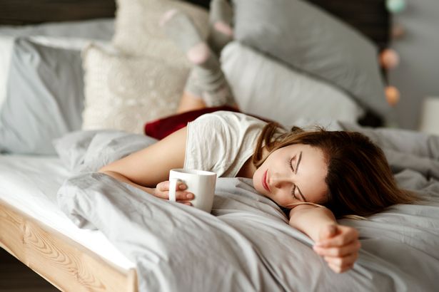 0_Woman-with-coffee-reclining-in-bed