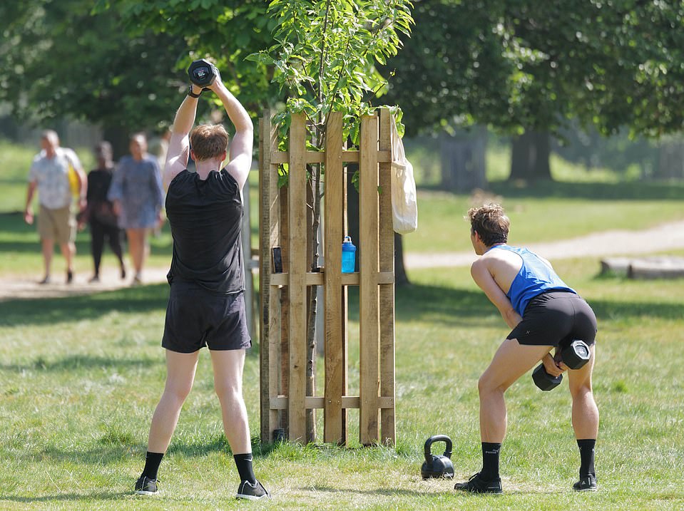 28193492-8304549-Two_people_enjoy_a_work_out_in_Richmond_Park_south_west_London_t-a-60_1589105986648