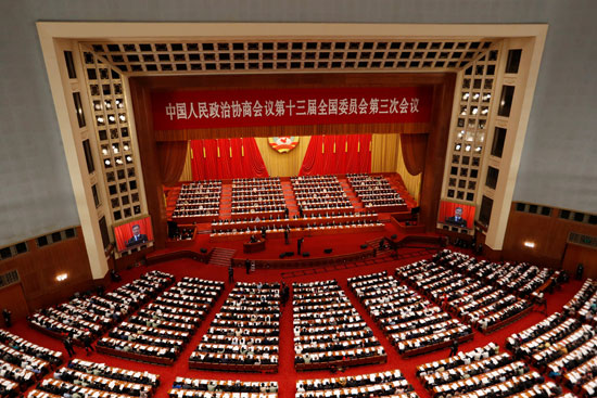 المسئولون والمندوبون الصينيون يحضرون الجلسة الافتتاحية للمؤتمر