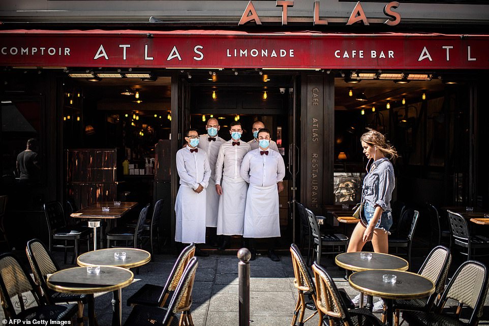 29120952-8379491-Waiters_pose_at_their_terrasse_of_their_restaurant_rue_de_Buci_i-a-28_1591096943676