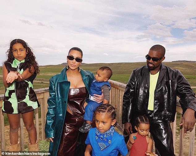 30954036-8540405-Kanye_West_pictured_with_wife_Kim_Kardashian_and_their_children_-a-3_1595243031447
