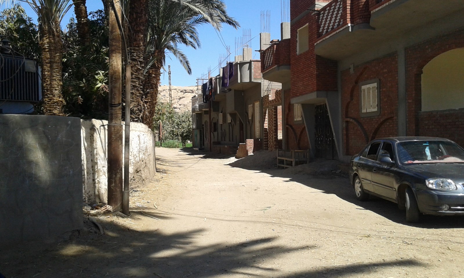 شوارع قرية خور أبو علي الجارى تطويرها ضمن مبادرة حياة كريمة (1)