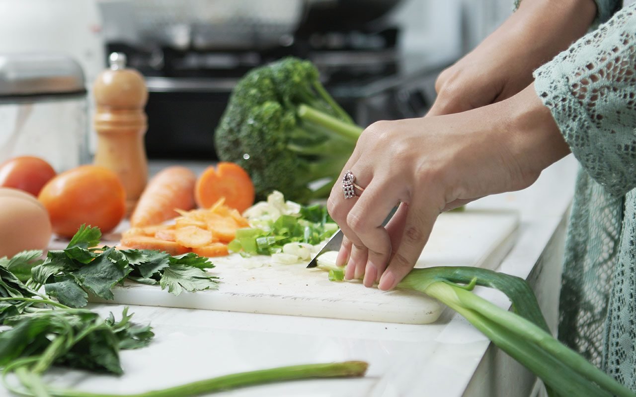 human-hands-slicing-vegetables-in-kitchen-healthy-food-woman-preparing-vegetables-shutterstock_1432293920