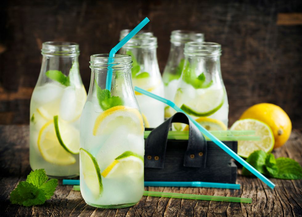 lemonade-in-glass-bottle-with-ice-and-mint-news-photo-1147799616-1562536022
