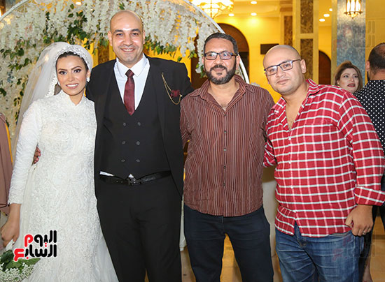 الزميلان-محمد-أشرف-ومحمود-يسن-والعروسان