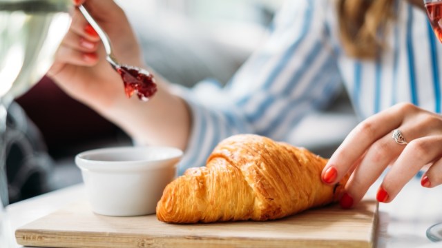 woman-eating-croissant