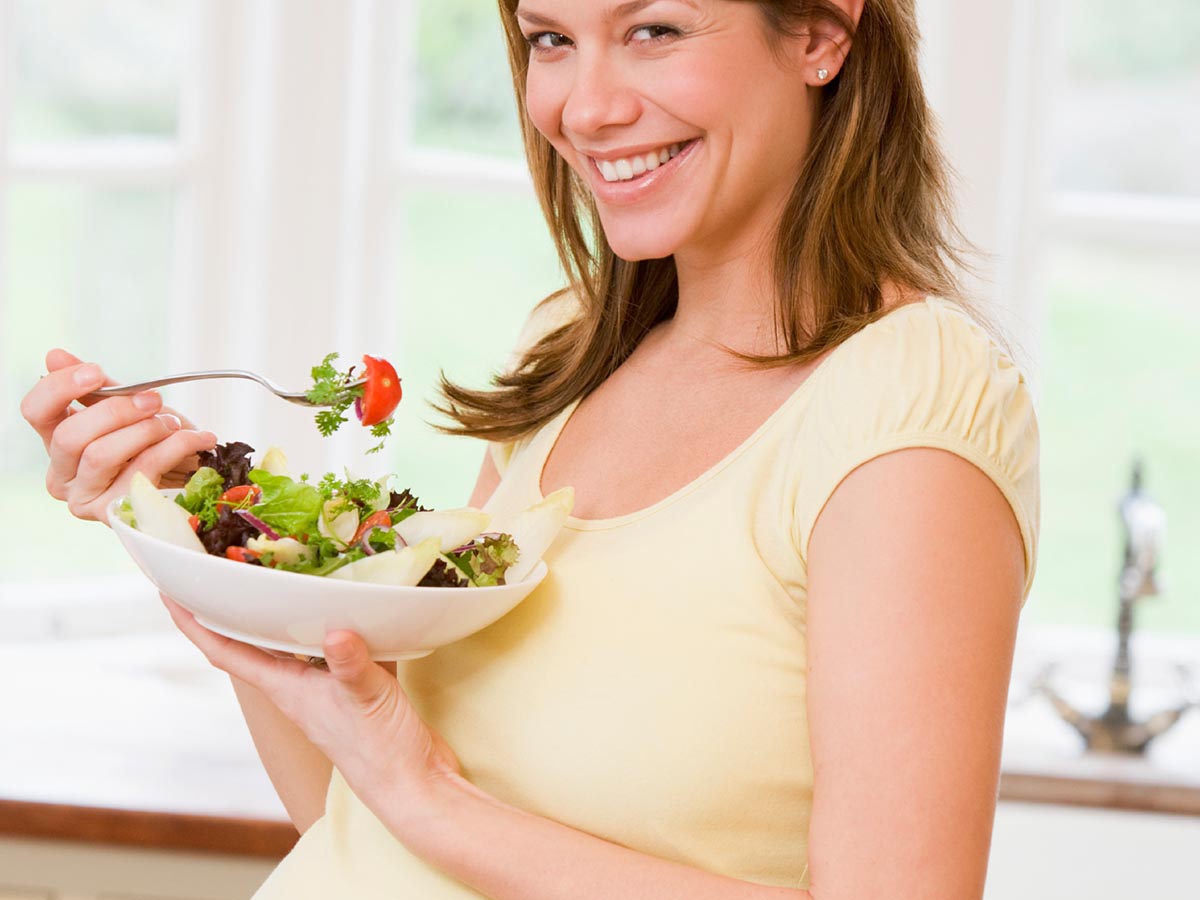 A pregnant woman eats