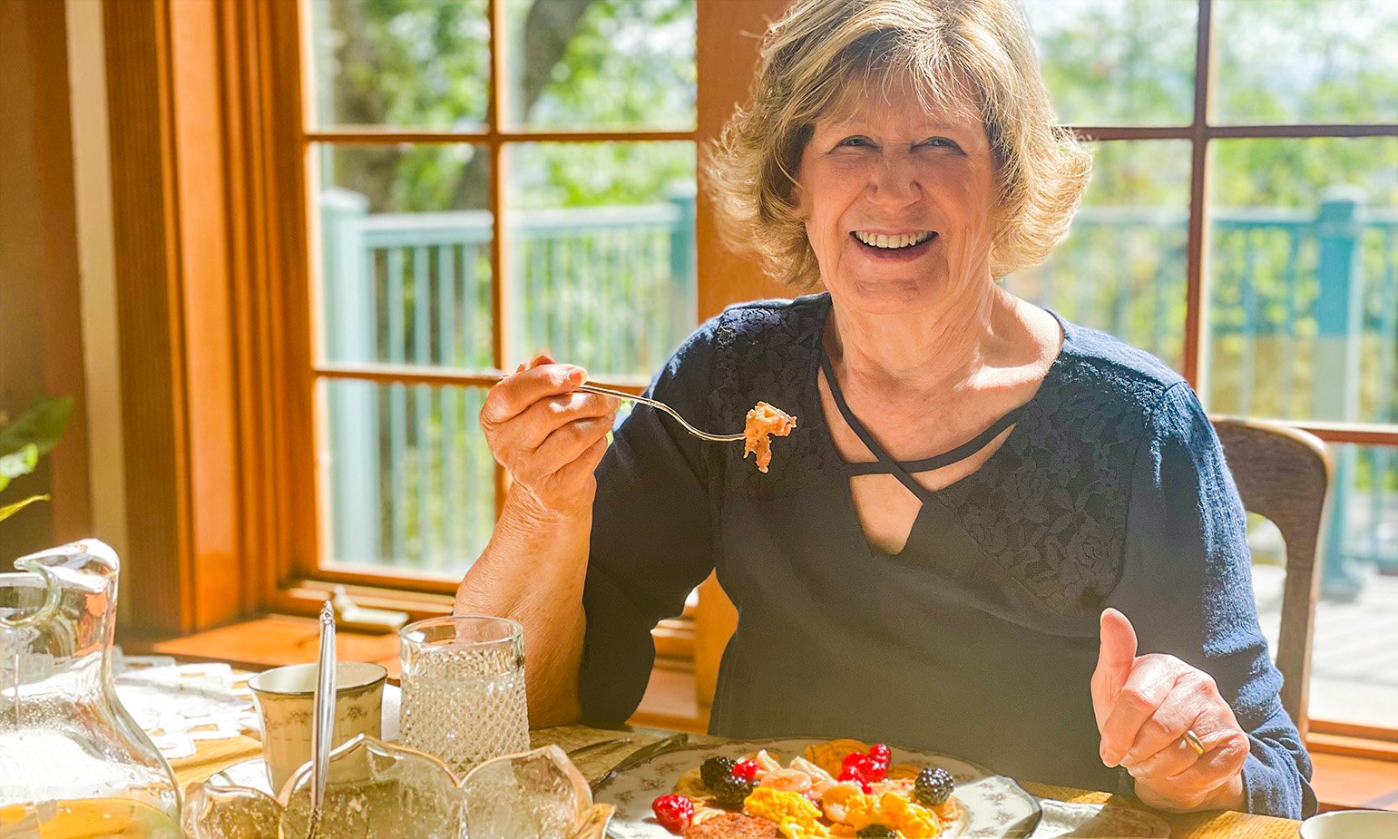 senior-woman-enjoying-healthy-meal-dining-table-at-home