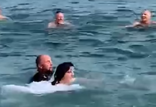 The newlyweds in the water
