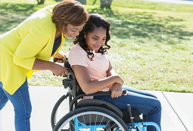 mother-teenage-daughter-spina-bifida-wheelchair-disabled