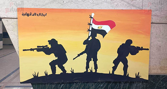 رفع-العلم-المصري-وتغطيه-المقاتلين-لزميلهم-علي-أرض-الفيروز