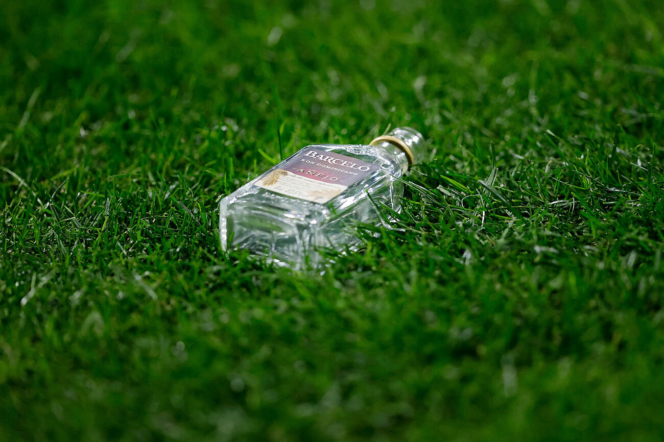 A bottle of wine on the field
